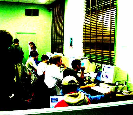 Activists on computers in an Indymedia Centre